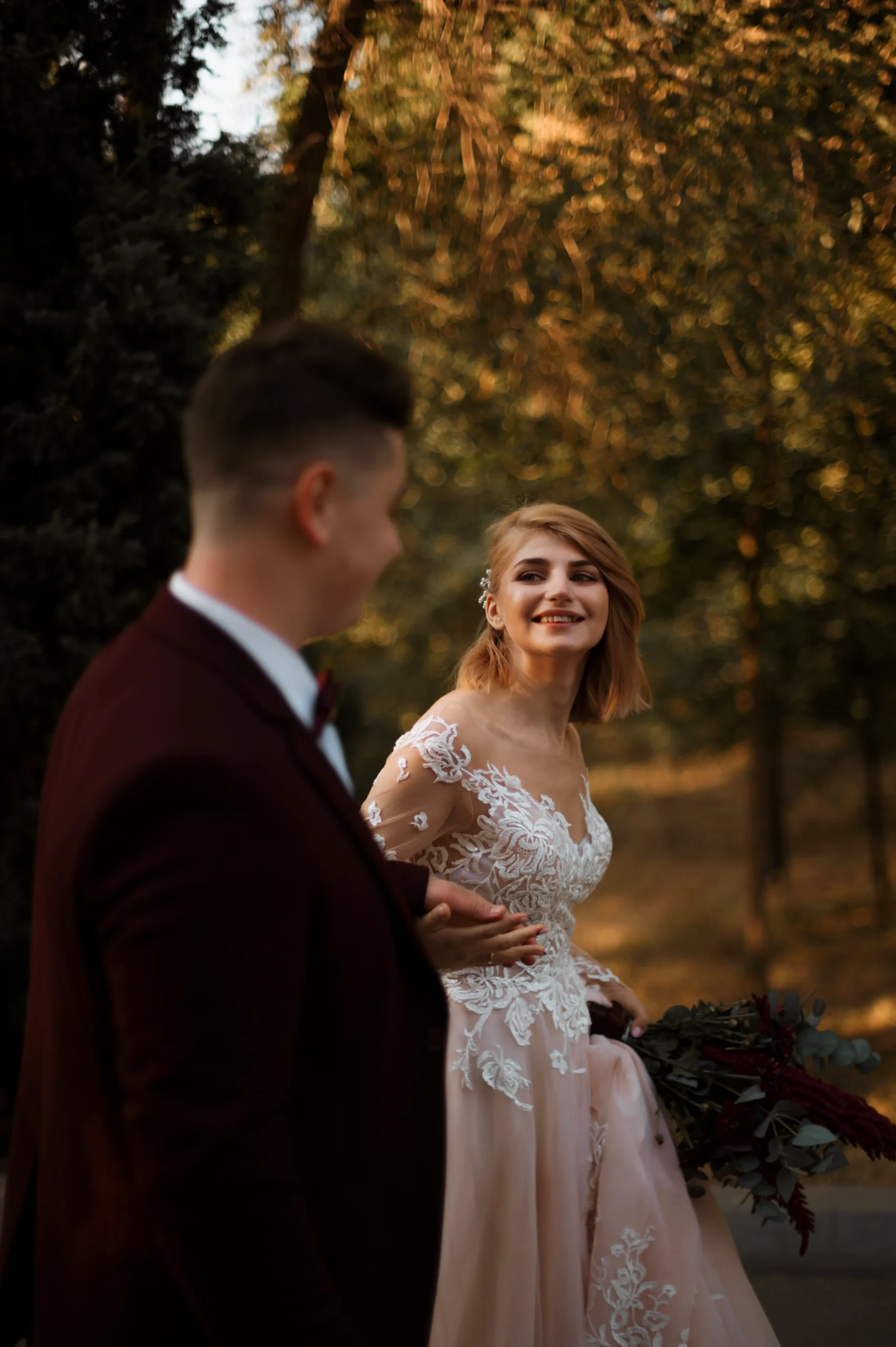 side-view-bride-groom-holding-hands